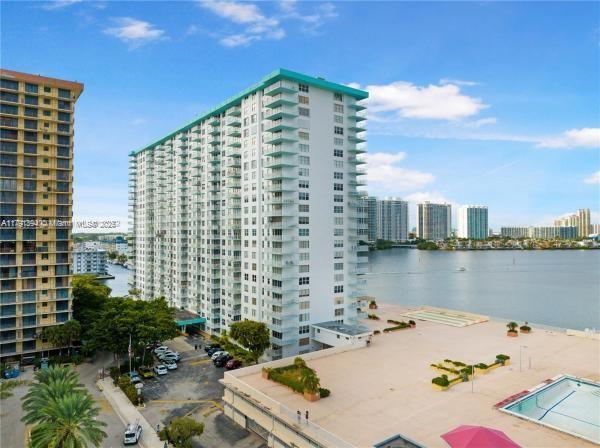 view of property with a view of city and a water view