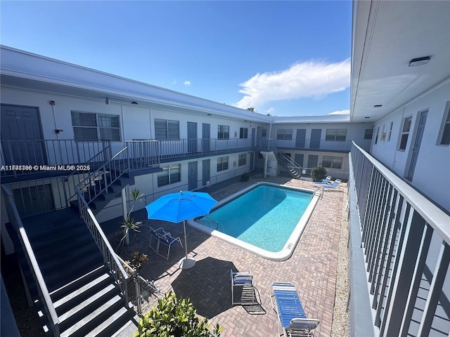 community pool featuring stairs