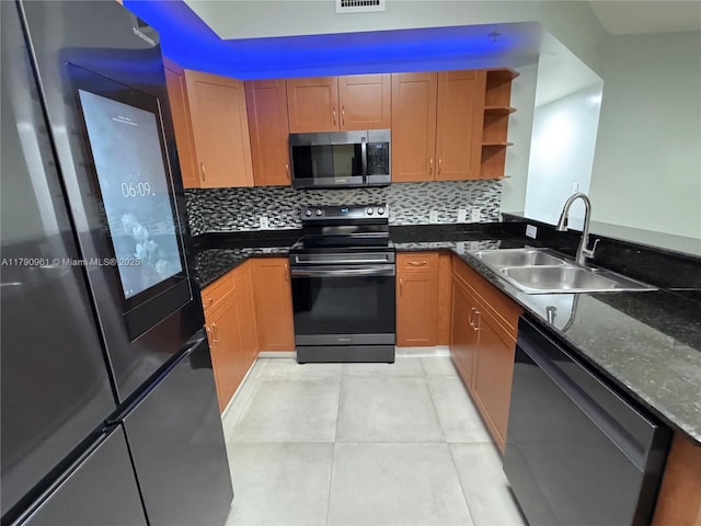 kitchen with a sink, open shelves, black appliances, visible vents, and backsplash