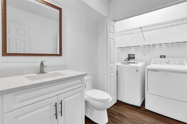 23140 Island Vw Unit 3, Boca Raton, FL 33433 - bathroom with vanity, toilet, wood finished floors, and washer and clothes dryer