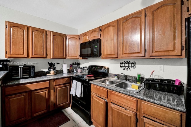 1910 NW 72nd St, Miami, FL 33147 - kitchen featuring black appliances, light tile patterned floors, brown cabinetry, and a sink