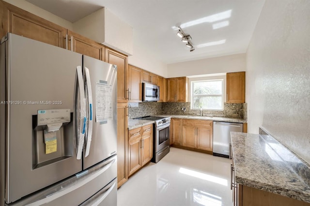 2600 S Ocean Dr Unit S314, Hollywood, FL 33019 - kitchen featuring light stone countertops, a sink, backsplash, and stainless steel appliances