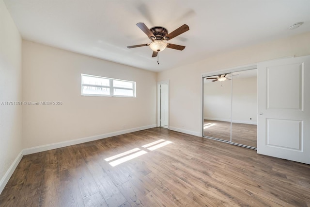 2600 S Ocean Dr Unit S314, Hollywood, FL 33019 - unfurnished bedroom featuring a closet, a ceiling fan, wood finished floors, and baseboards