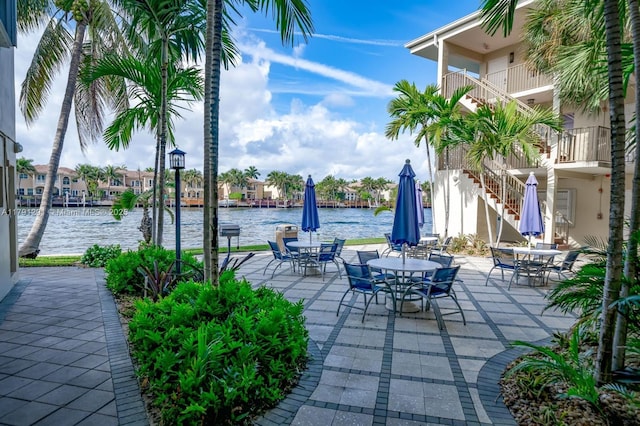 2600 S Ocean Dr Unit S314, Hollywood, FL 33019 - view of patio with outdoor dining area, a water view, and stairway