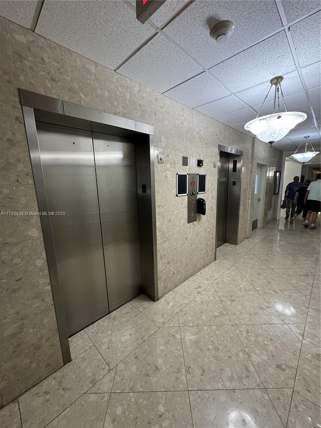 2150 Sans Souci Blvd Unit B611, North Miami, FL 33180 - hallway with elevator and a paneled ceiling
