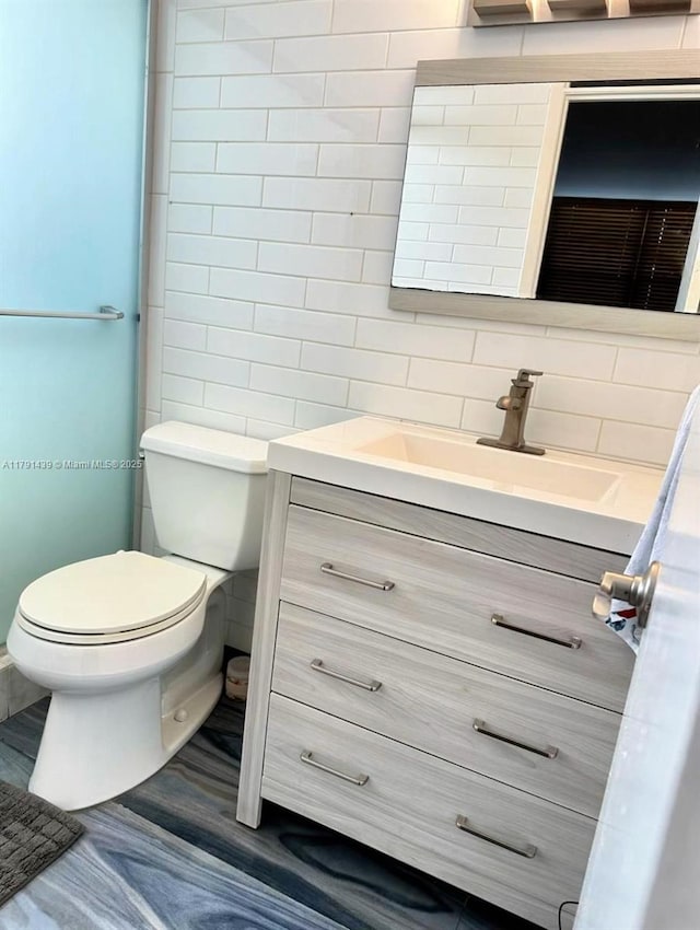 2150 Sans Souci Blvd Unit B611, North Miami, FL 33180 - bathroom with vanity, toilet, and tasteful backsplash