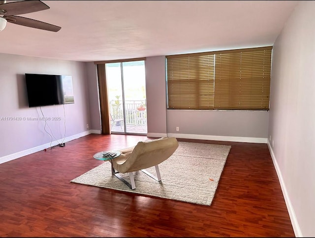 2150 Sans Souci Blvd Unit B611, North Miami, FL 33180 - sitting room featuring ceiling fan, baseboards, wood finished floors, and floor to ceiling windows
