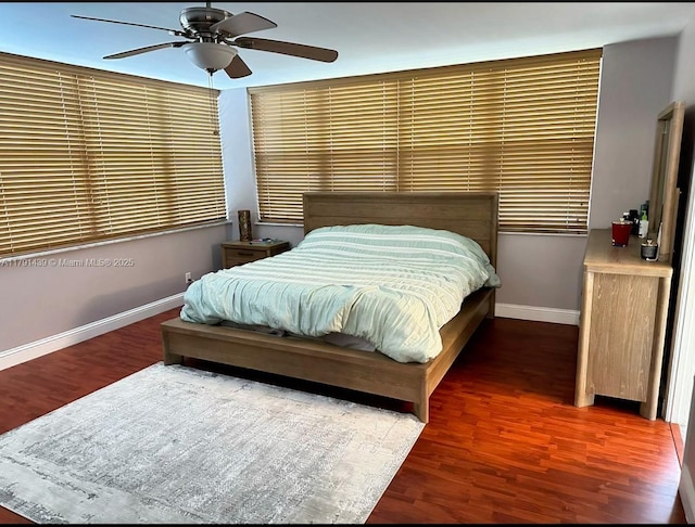 2150 Sans Souci Blvd Unit B611, North Miami, FL 33180 - bedroom with baseboards, wood finished floors, and ceiling fan