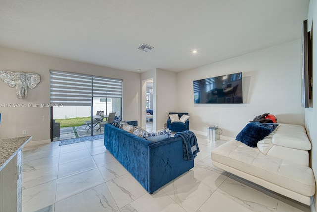 living room with recessed lighting, visible vents, and marble finish floor