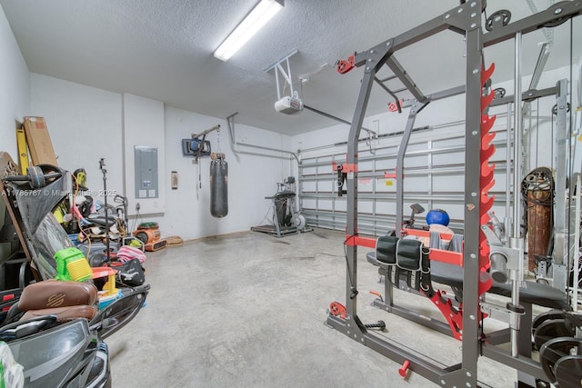 garage with a garage door opener and electric panel