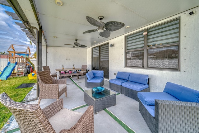 view of patio / terrace with an outdoor hangout area, ceiling fan, and playground community