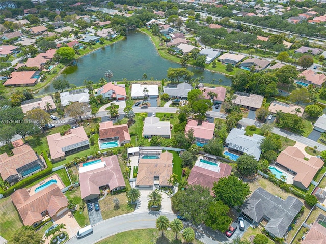 bird's eye view with a residential view and a water view
