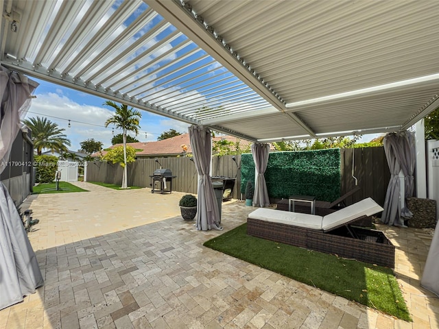 view of patio / terrace with a pergola and a fenced backyard