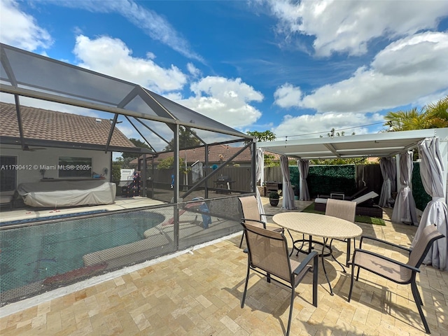 view of patio / terrace featuring fence, glass enclosure, and a fenced in pool