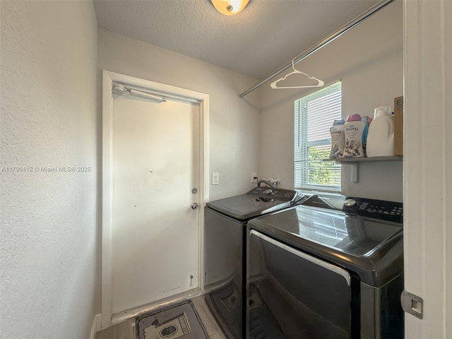 clothes washing area featuring laundry area and independent washer and dryer