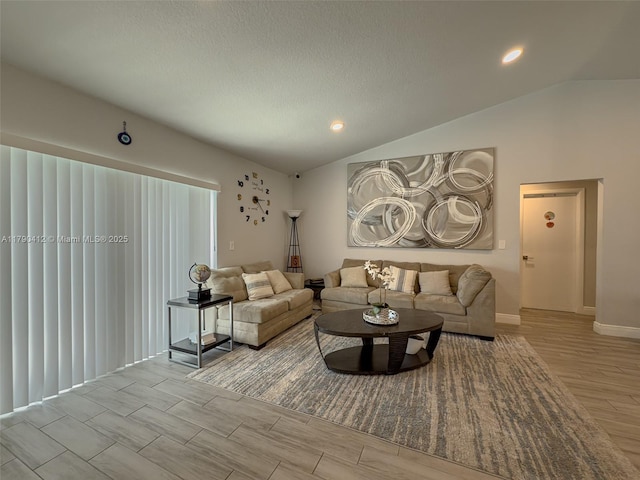 living area featuring baseboards, light wood-type flooring, recessed lighting, and vaulted ceiling