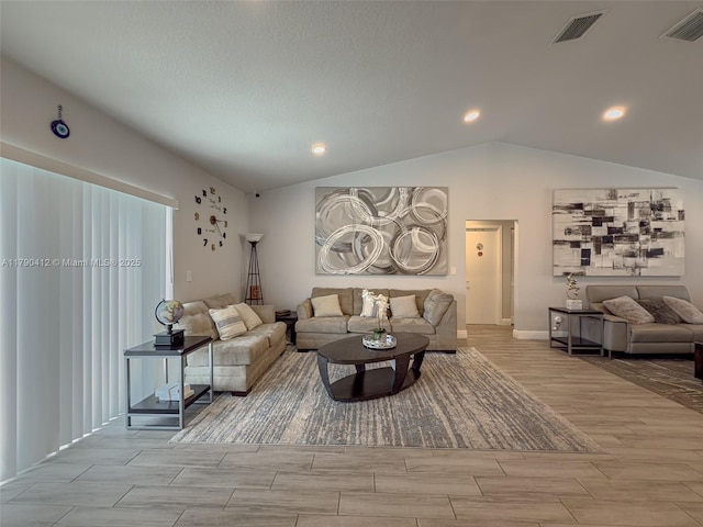 living room featuring visible vents, recessed lighting, wood tiled floor, and vaulted ceiling