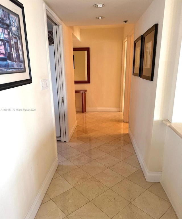 1627 Brickell Ave Unit 2005, Miami, FL 33129 - corridor with baseboards and light tile patterned floors