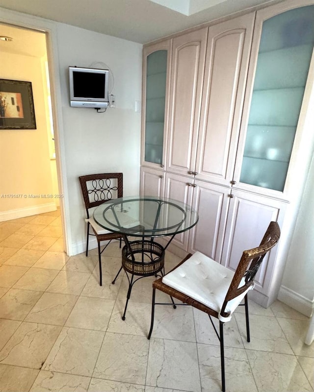 1627 Brickell Ave Unit 2005, Miami, FL 33129 - dining area with baseboards