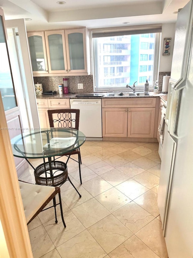 1627 Brickell Ave Unit 2005, Miami, FL 33129 - kitchen with white appliances, decorative backsplash, plenty of natural light, and a sink