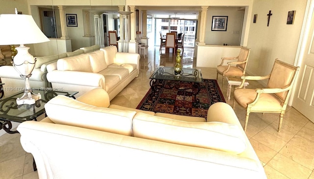 1627 Brickell Ave Unit 2005, Miami, FL 33129 - living area featuring tile patterned floors, baseboards, and ornate columns