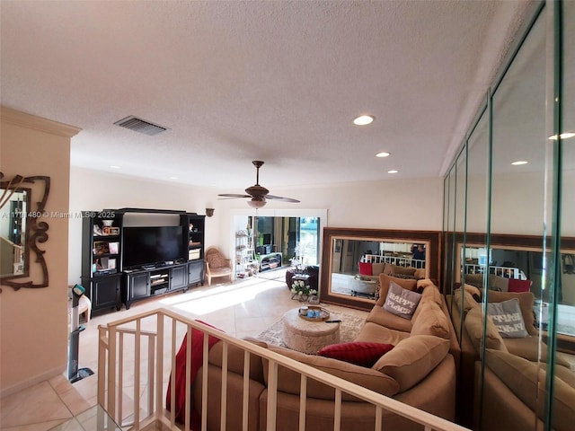 21338 Juego Cir Unit 11C, Boca Raton, FL 33433 - living room with a textured ceiling, light tile patterned floors, a ceiling fan, and recessed lighting
