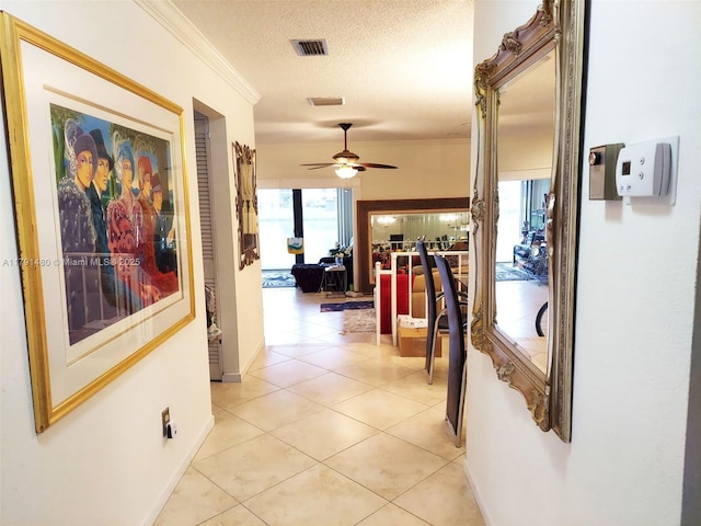 21338 Juego Cir Unit 11C, Boca Raton, FL 33433 - corridor with ornamental molding, a textured ceiling, light tile patterned flooring, and baseboards