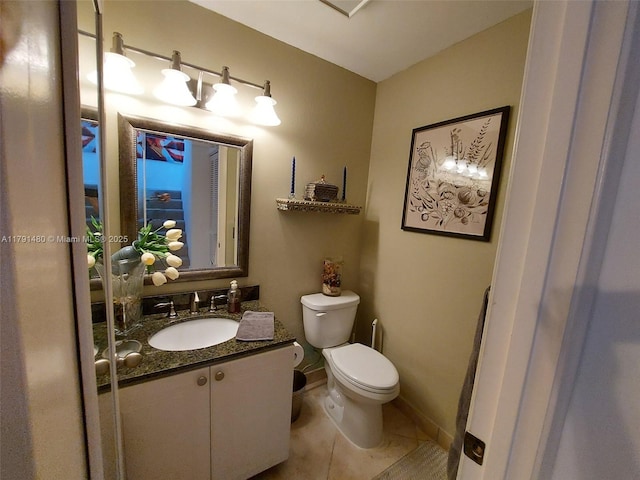 21338 Juego Cir Unit 11C, Boca Raton, FL 33433 - half bathroom with vanity, toilet, tile patterned flooring, and baseboards