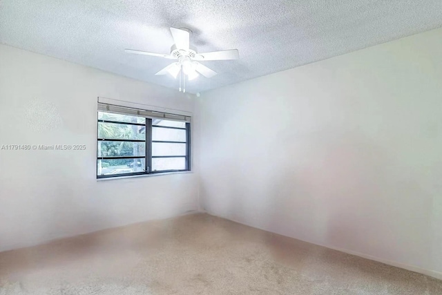 21338 Juego Cir Unit 11C, Boca Raton, FL 33433 - spare room with carpet, ceiling fan, and a textured ceiling