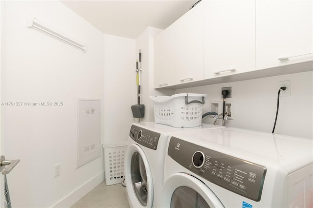 laundry room with baseboards, cabinet space, and independent washer and dryer