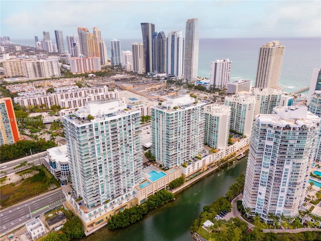 drone / aerial view with a city view and a water view