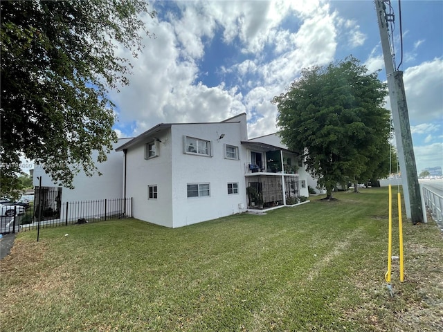 9520 SW 8th St Unit 211, Miami, FL 33174 - rear view of house featuring a lawn, stucco siding, and fence