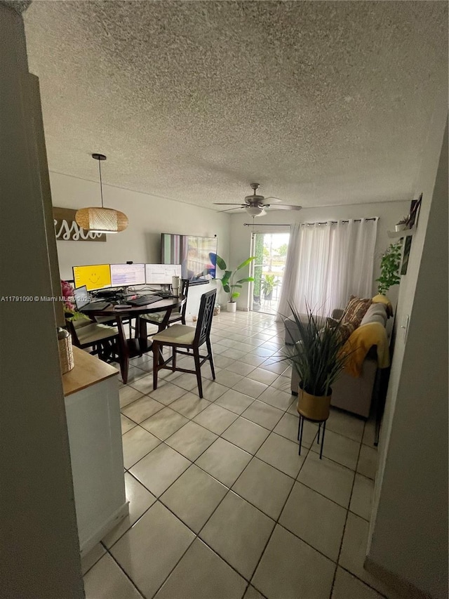 9520 SW 8th St Unit 211, Miami, FL 33174 - dining area with light tile patterned floors, a ceiling fan, and a textured ceiling