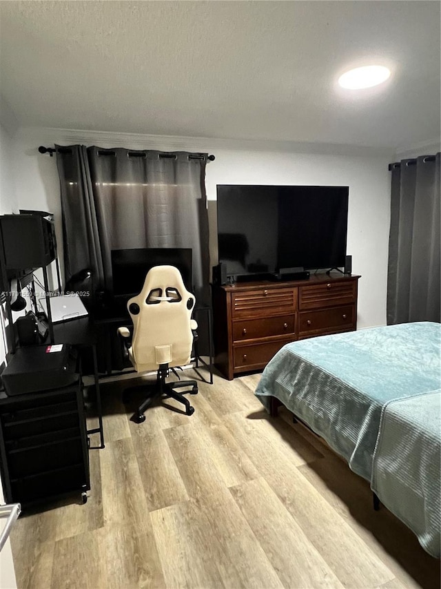 bedroom featuring light wood-style flooring