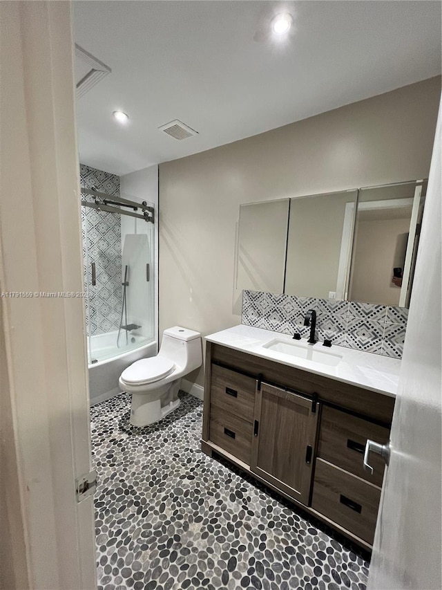 full bath featuring shower / bath combination with glass door, recessed lighting, vanity, toilet, and visible vents