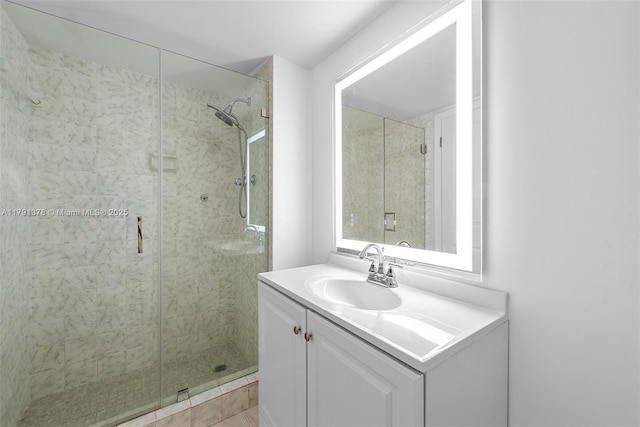 full bath featuring a stall shower and vanity