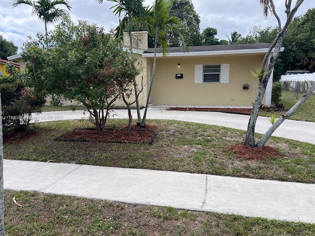 4410 NW 30th Ct, Lauderdale Lakes, FL 33313 - view of front of house featuring stucco siding