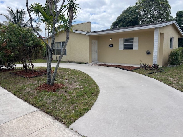 4410 NW 30th Ct, Lauderdale Lakes, FL 33313 - single story home featuring stucco siding and curved driveway