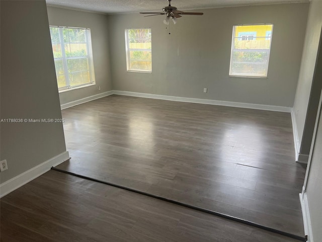 4410 NW 30th Ct, Lauderdale Lakes, FL 33313 - unfurnished room with dark wood-style floors, a ceiling fan, a textured ceiling, and baseboards