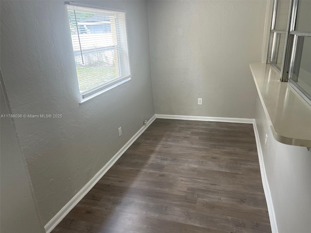 4410 NW 30th Ct, Lauderdale Lakes, FL 33313 - unfurnished room featuring a textured wall, wood finished floors, and baseboards