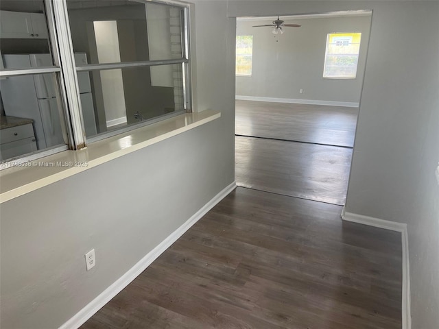 4410 NW 30th Ct, Lauderdale Lakes, FL 33313 - unfurnished room featuring a ceiling fan, wood finished floors, and baseboards