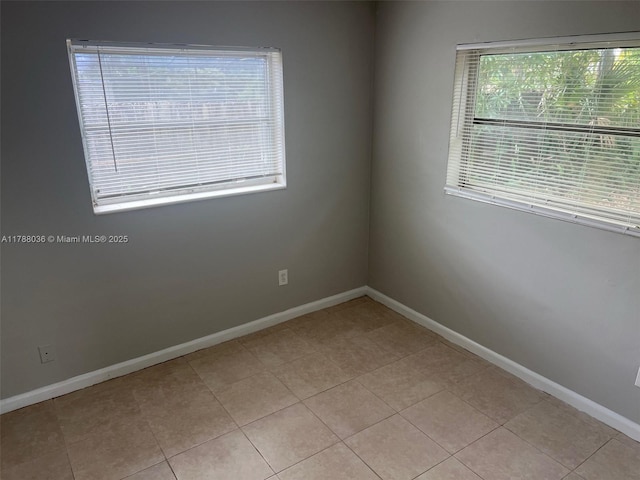 4410 NW 30th Ct, Lauderdale Lakes, FL 33313 - spare room featuring light tile patterned floors and baseboards