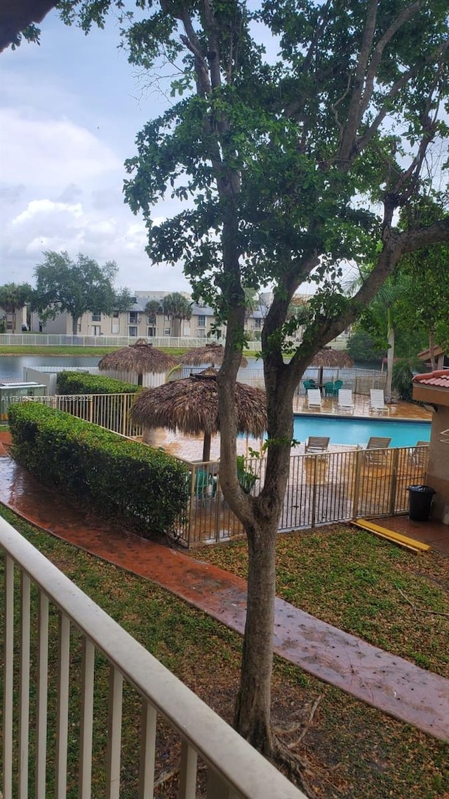 15231 SW 80th St Unit 209, Miami, FL 33193 - view of yard with a community pool and fence