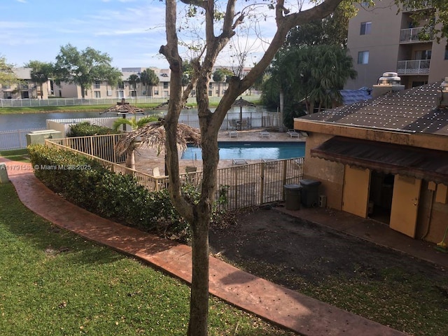 15231 SW 80th St Unit 209, Miami, FL 33193 - community pool with a water view and fence