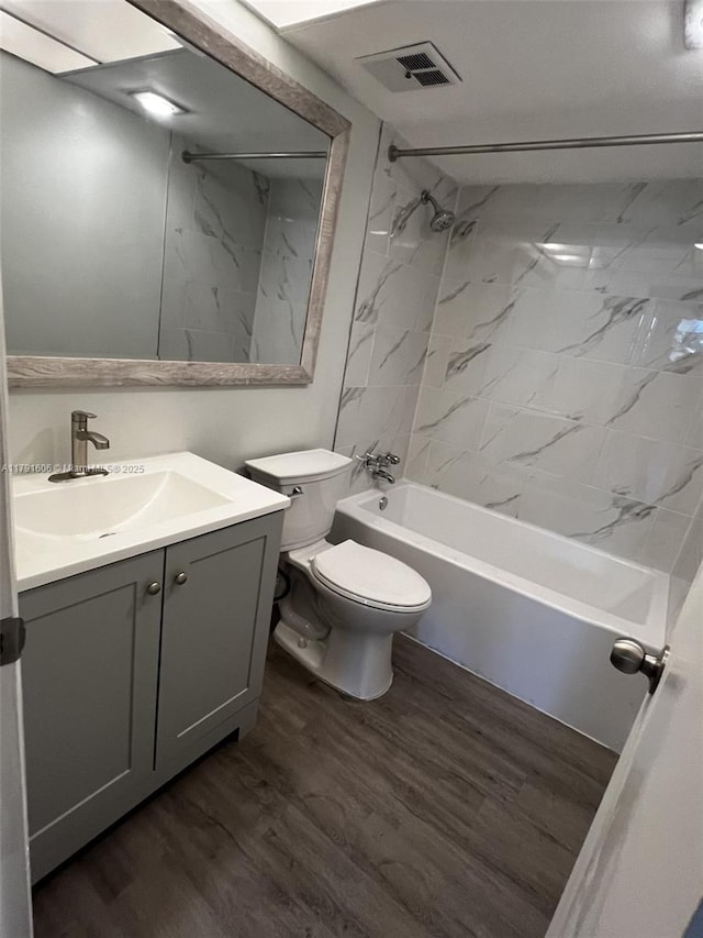 7000 NW 17th St Unit 109, Plantation, FL 33313 - bathroom featuring wood finished floors, visible vents, toilet, and tub / shower combination