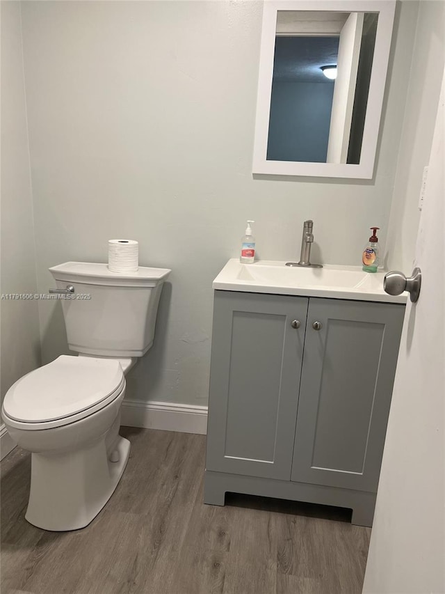 7000 NW 17th St Unit 109, Plantation, FL 33313 - bathroom with toilet, wood finished floors, vanity, and baseboards