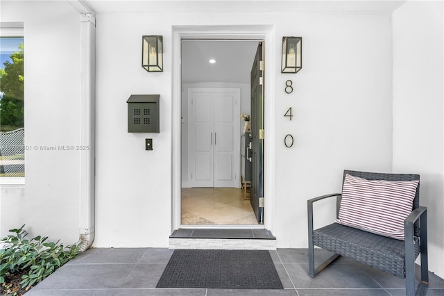 view of exterior entry featuring stucco siding