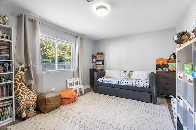 bedroom with wood finished floors