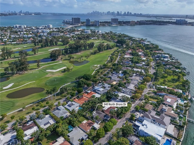 bird's eye view with a view of city, a residential view, a water view, and view of golf course