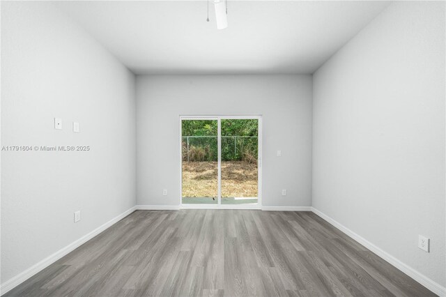 1429 Las Villas Blvd, Sebring, FL 33870 - empty room with wood finished floors and baseboards